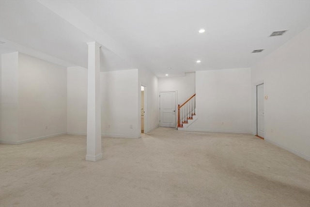 below grade area with stairway, recessed lighting, visible vents, and light colored carpet