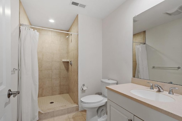 full bath featuring a shower stall, visible vents, vanity, and toilet