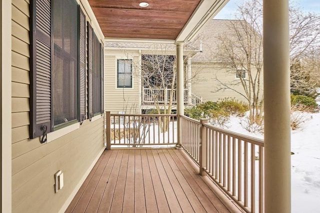 view of snow covered deck