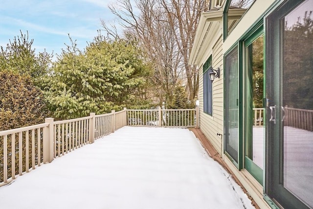 view of snow covered deck