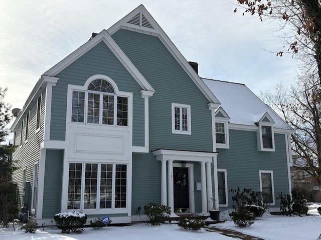 view of snow covered property