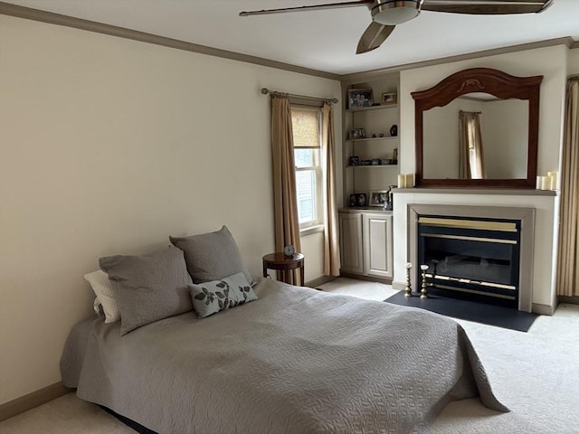 bedroom featuring crown molding, light colored carpet, and ceiling fan