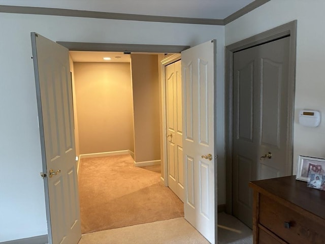 hallway featuring light colored carpet