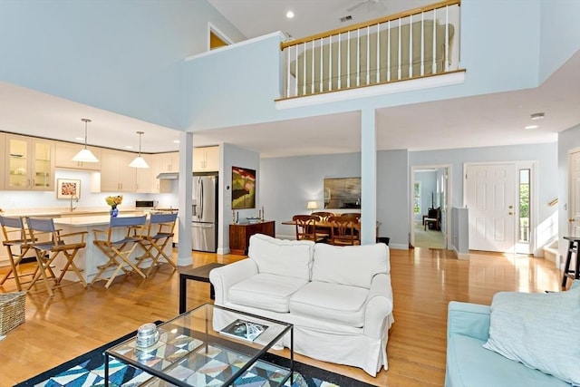 15 Berrywood Ct Unit 15, Bourne, MA 02532 - living area featuring recessed lighting, a high ceiling, baseboards, and light wood finished floors