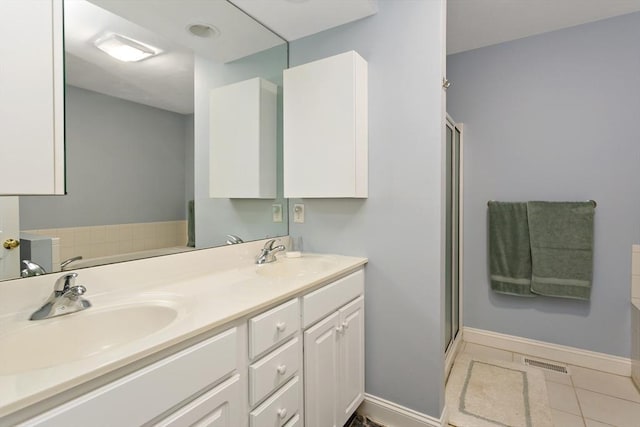 15 Berrywood Ct Unit 15, Bourne, MA 02532 - bathroom featuring a sink, a shower stall, double vanity, and visible vents