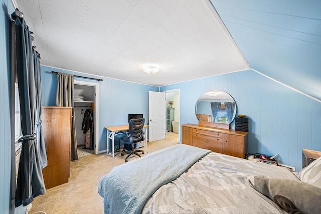 bedroom featuring light carpet and wooden walls