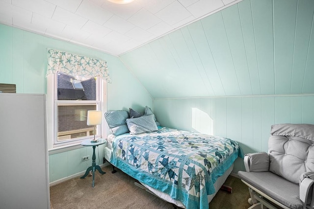 bedroom with multiple windows, carpet floors, and vaulted ceiling