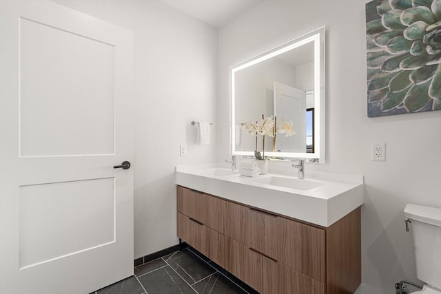 1515 Commonwealth Ave Unit 302, Boston, MA 02135 - bathroom featuring double vanity and toilet