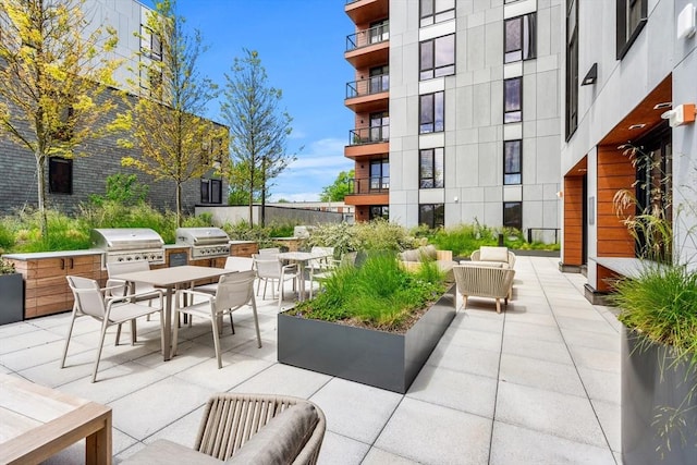 1515 Commonwealth Ave Unit 302, Boston, MA 02135 - view of patio / terrace with area for grilling, outdoor dining space, and an outdoor hangout area