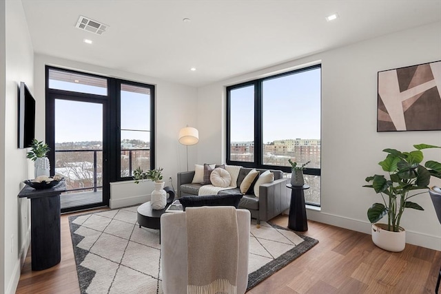 1515 Commonwealth Ave Unit 302, Boston, MA 02135 - living area with light wood-type flooring and recessed lighting