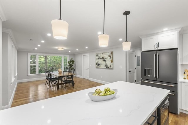 315 Maple Ave, Shrewsbury, MA 01545 - kitchen featuring high end fridge, light wood-style flooring, crown molding, recessed lighting, and white cabinetry