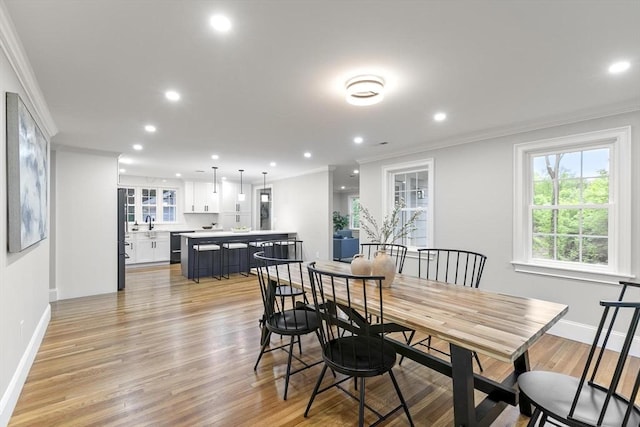 315 Maple Ave, Shrewsbury, MA 01545 - dining room with ornamental molding, recessed lighting, baseboards, and light wood-style flooring