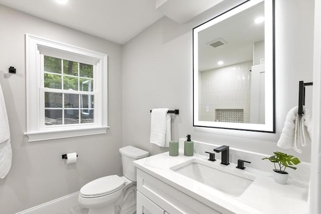 315 Maple Ave, Shrewsbury, MA 01545 - bathroom with toilet, vanity, baseboards, and a shower