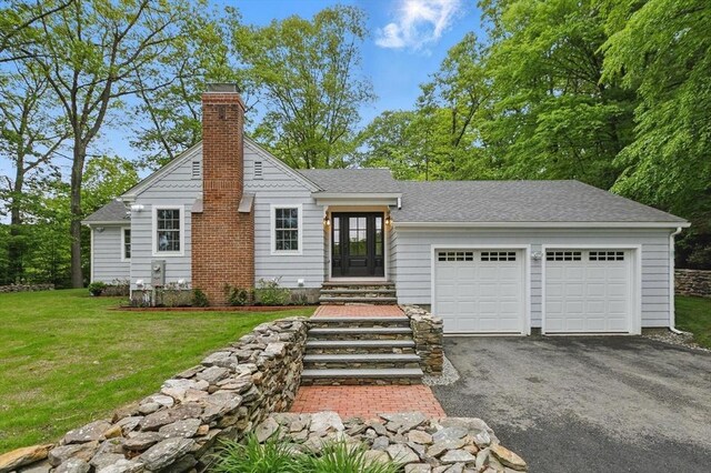 315 Maple Ave, Shrewsbury, MA 01545 - view of front of home with driveway, a chimney, an attached garage, a front lawn, and a shingled roof