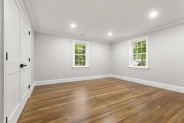 315 Maple Ave, Shrewsbury, MA 01545 - empty room with ornamental molding, healthy amount of natural light, light wood finished floors, baseboards, and recessed lighting