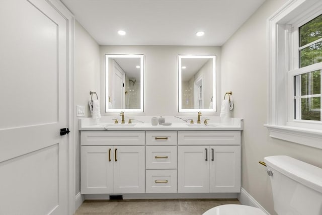 315 Maple Ave, Shrewsbury, MA 01545 - bathroom with toilet, double vanity, baseboards, and recessed lighting