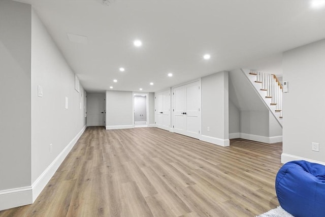 315 Maple Ave, Shrewsbury, MA 01545 - unfurnished living room with stairs, light wood-type flooring, recessed lighting, and baseboards