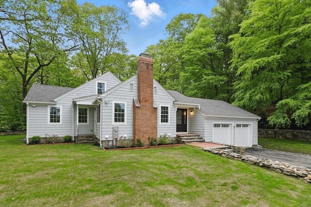 315 Maple Ave, Shrewsbury, MA 01545 - view of front of property featuring a garage, a chimney, driveway, and a front yard