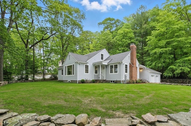 315 Maple Ave, Shrewsbury, MA 01545 - view of front of house featuring a chimney, a front yard, and a garage