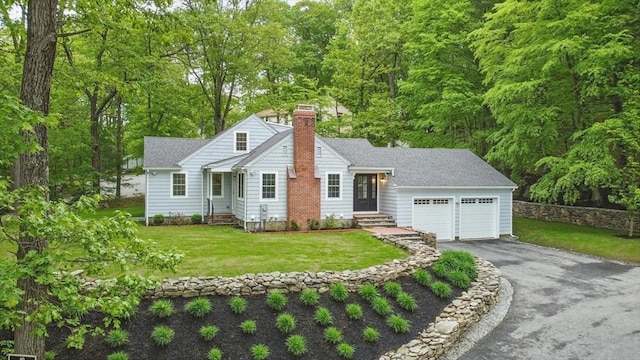 315 Maple Ave, Shrewsbury, MA 01545 - view of front facade with a chimney, a garage, asphalt driveway, entry steps, and a front lawn