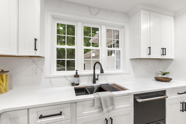 315 Maple Ave, Shrewsbury, MA 01545 - kitchen with a sink, tasteful backsplash, and white cabinets