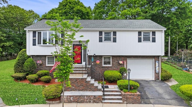 30 Lanark Rd, Malden, MA 02148 - raised ranch with an attached garage, brick siding, a front yard, driveway, and roof with shingles