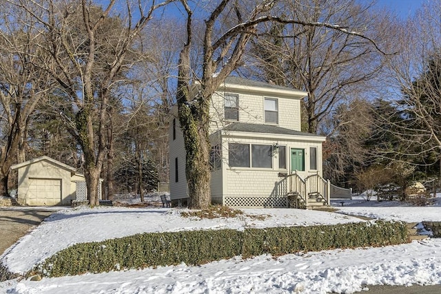 view of property with an outbuilding and a garage