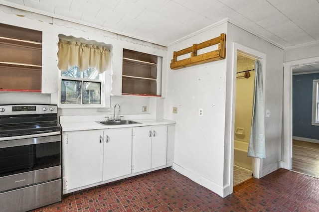 kitchen with white cabinetry, electric stove, crown molding, and sink