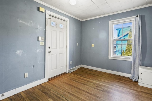 entryway featuring ornamental molding and hardwood / wood-style floors