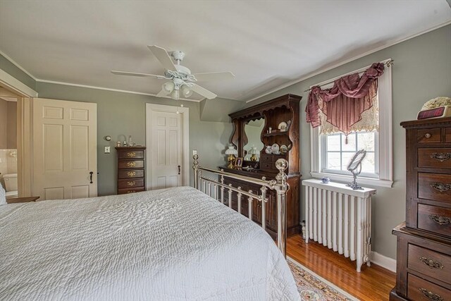 27 Carrlyn Rd, Brockton, MA 02301 - bedroom featuring crown molding, radiator heating unit, ceiling fan, and wood finished floors