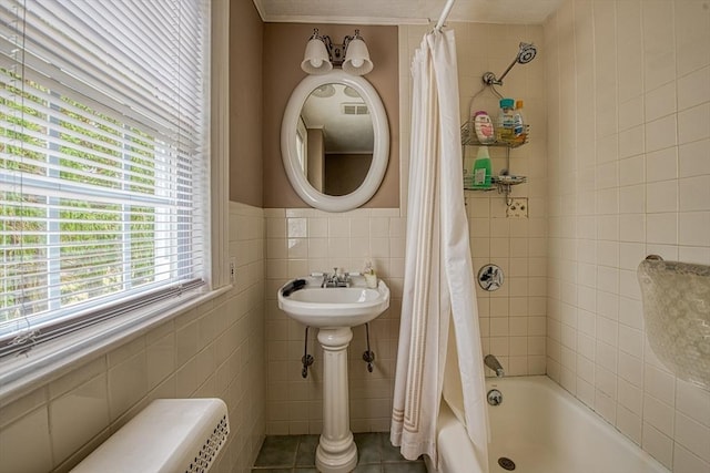 27 Carrlyn Rd, Brockton, MA 02301 - bathroom featuring shower / tub combo, tile walls, crown molding, wainscoting, and tile patterned flooring