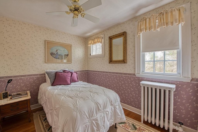 27 Carrlyn Rd, Brockton, MA 02301 - bedroom featuring wood finished floors, radiator heating unit, multiple windows, and wallpapered walls