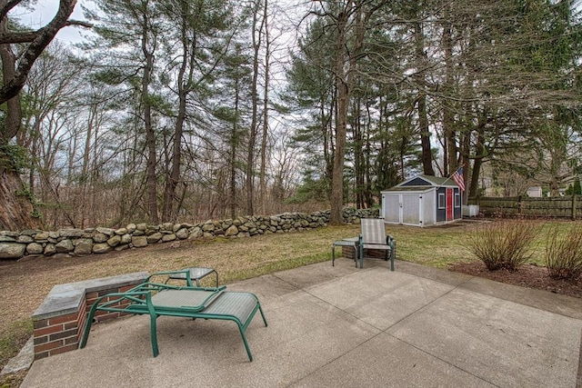 27 Carrlyn Rd, Brockton, MA 02301 - view of patio with a storage shed, an outbuilding, and fence