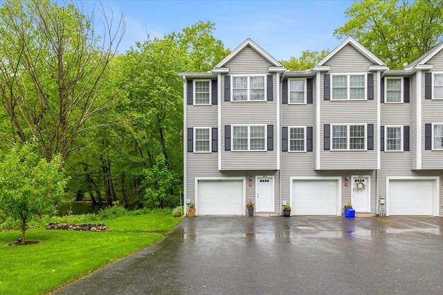 63 Shrine Ave Unit 1, West Boylston, MA 01583 - multi unit property featuring asphalt driveway, a garage, and a front yard