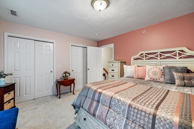 63 Shrine Ave Unit 1, West Boylston, MA 01583 - bedroom featuring two closets and light colored carpet