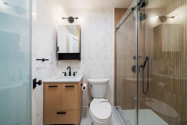 bathroom with vanity, toilet, and an enclosed shower