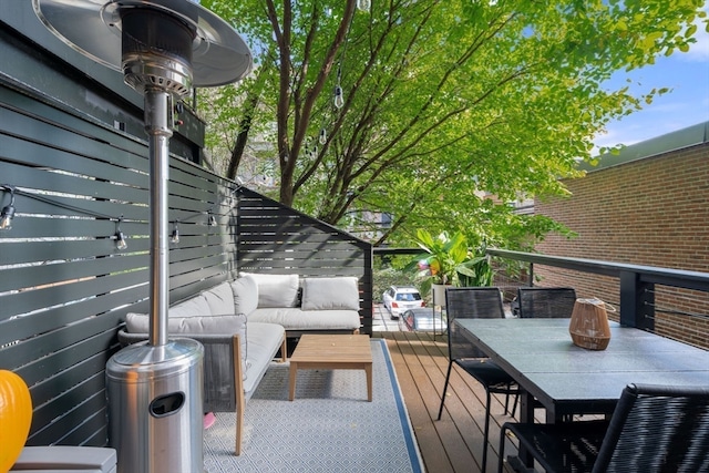 wooden terrace featuring an outdoor living space