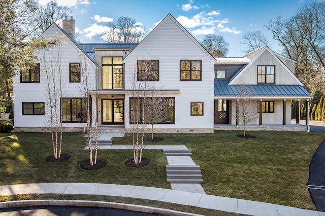 modern farmhouse featuring a front lawn