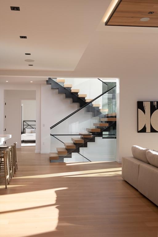 stairway featuring hardwood / wood-style floors