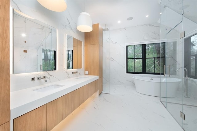 bathroom featuring vanity, shower with separate bathtub, and tile walls