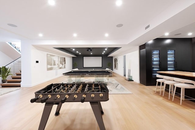 playroom with light hardwood / wood-style floors