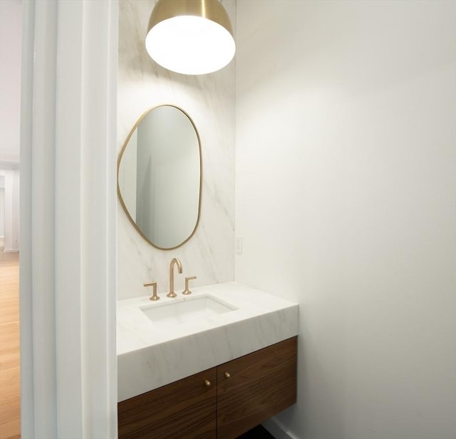 bathroom featuring vanity and wood-type flooring