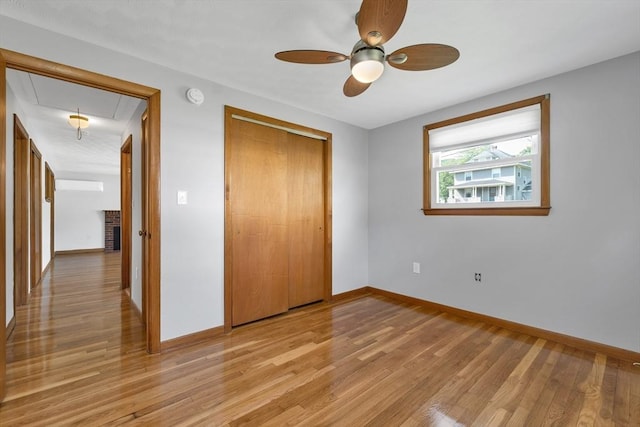 21 Gile St, Haverhill, MA 01830 - unfurnished bedroom with attic access, light wood finished floors, baseboards, a closet, and a ceiling fan