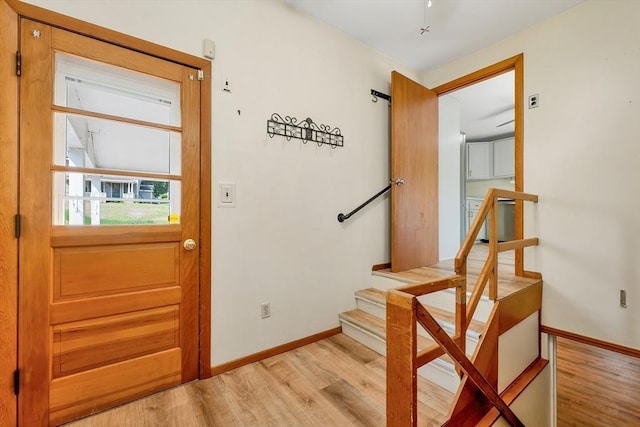 21 Gile St, Haverhill, MA 01830 - entryway featuring light wood-type flooring, baseboards, and stairs
