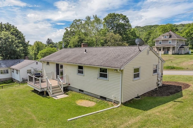21 Gile St, Haverhill, MA 01830 - back of property with a shingled roof, a deck, a yard, and a chimney
