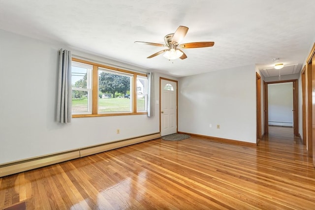21 Gile St, Haverhill, MA 01830 - spare room with attic access, baseboard heating, ceiling fan, and light wood-type flooring