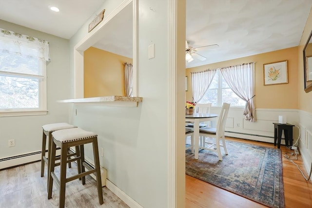 15 Ashlee Gln, Lynn, MA 01904 - dining space featuring light wood finished floors, ceiling fan, and a baseboard radiator