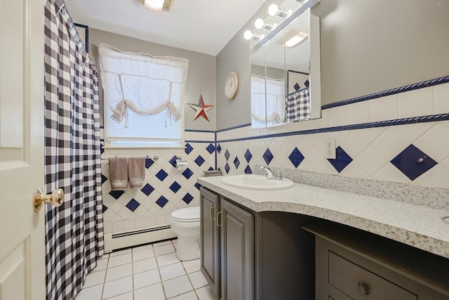 15 Ashlee Gln, Lynn, MA 01904 - bathroom featuring tile patterned flooring, a baseboard radiator, toilet, vanity, and tile walls