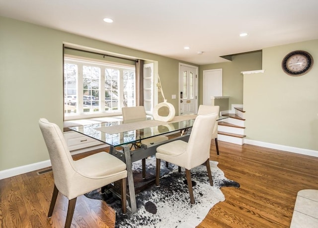 dining space featuring recessed lighting, visible vents, baseboards, and wood finished floors