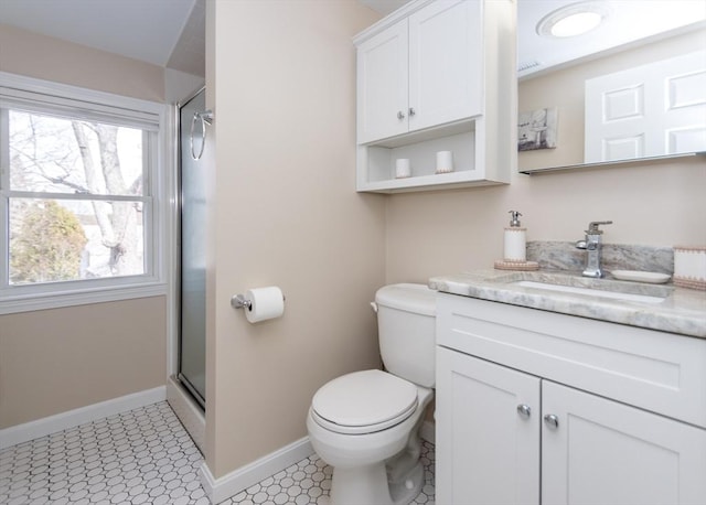 bathroom with a shower with shower door, baseboards, toilet, and vanity